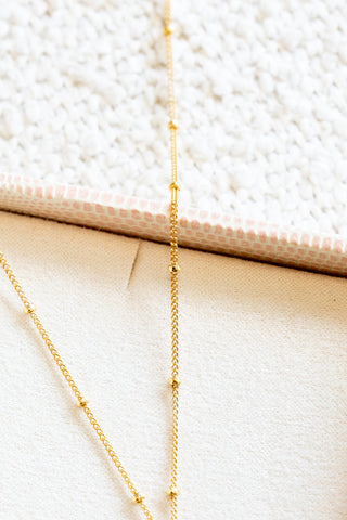 Stamped Plumeria Heart Dainty Beam Necklace